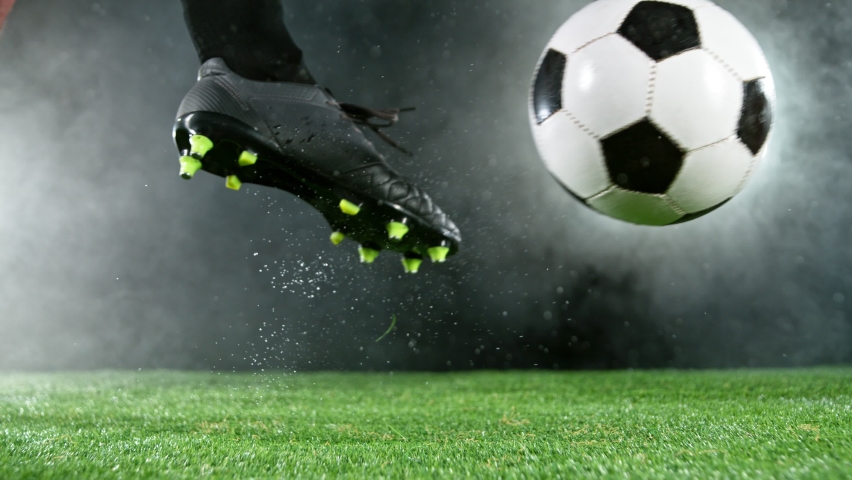 Super slow motion of soccer player kicking the ball. Filmed on high speed cinema camera, 1000fps. Speed ramp effect. Royalty-Free Stock Footage #1089201973