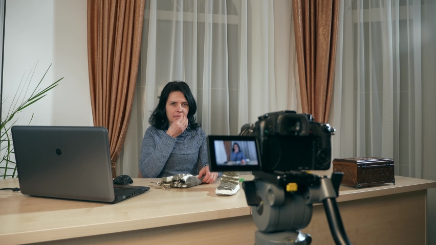 Young Female Video Blogger Woman Shows on DSLR Camera Knit with Knitting Crochet. Streaming Handicraft at Home. 2x Slow motion 60fps 4K