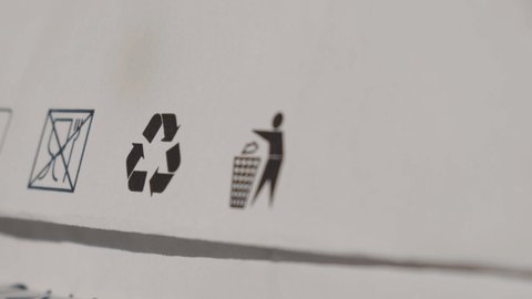 Recycling bag Closeup view of pap sign and other eco-label on Brown paper bag that is 100 recyclable and reusable spbd. Symbol indicates paper and cardboard. Concept: ecology environmental safety