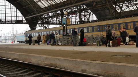 LVIV, UKRAINE - JANUARY 5, 2018: Rails and platform of Lviv railway station in Ukraine. 4K, Editorial, Handheld. Contains audio