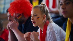 German football fans celebrating their team's victory at stadium. - Powered by Shutterstock - Get 15% off with code: PIKWIZARD15