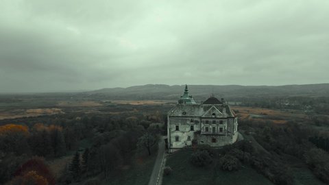 aerial view drone flight around of Old fairytale castle on the hill in Ukraine. Olesko Castle from above, Lviv district, Ukraine. Aerial video. Fortification sights of Ukraine