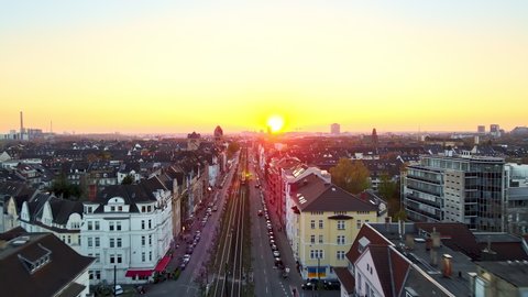 Drone shot over the houses in the direction of the sun in Dusseldorf