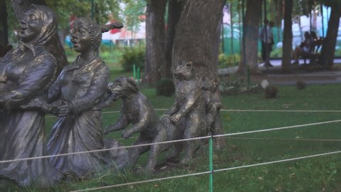 Samara, Russia - July 28, 2021: Sculpture in the park based on the Russian folk tale Turnip or Repka. Camera panning