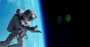 Female astronaut having a video call on her phone while performing space walk in open space, Earth in the background. Shot with 2x anamorphic lens