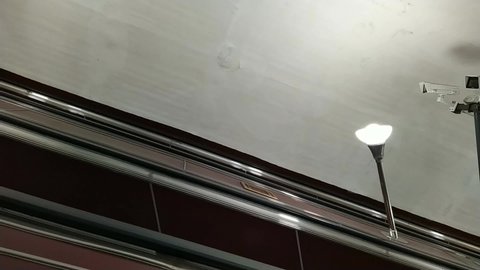 empty escalator movement in subway side view