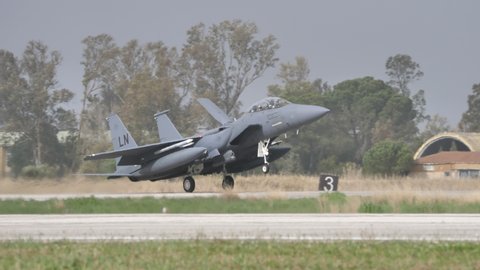 Andravida Greece APRIL, 1, 2022 American bomber fighter jet plane lands on military airport in bad weather. McDonnell Douglas Boeing F-15E Strike combat aircraft of United States Air Force USAF