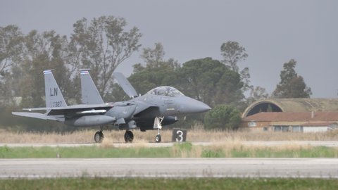Andravida Greece APRIL, 1, 2022 Military plane lands with huge dorsal air brake opened. McDonnell Douglas Boeing F-15E Strike Eagle multirole fighter jet of United States Air Force in Europe USAFE