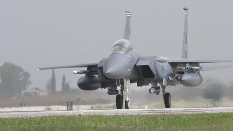 Andravida Greece APRIL, 1, 2022 Modern American supersonic bomber taxi on the runway. These planes can fight in any weather. Boeing F-15E Strike Eagle of United States Air Force USAF