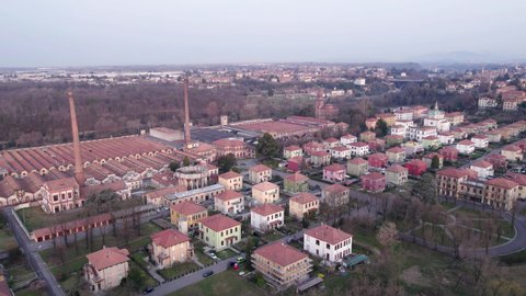 Crespi d’Adda, Italy - March 21, 2022: The UNESCO world heritage site worker’s village near Bergamo, Lombardy. Aerial view.