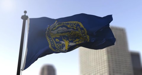 Nebraska state waving flag on blurry background, USA state news illustration. Blurry background
