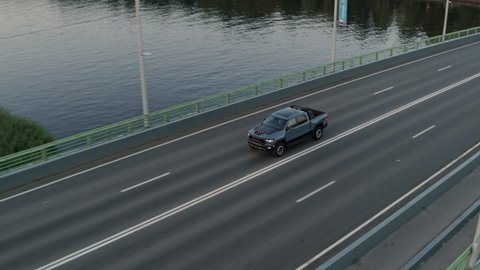 American pickup car Dodge Ram TRX driving on the asphalt road. Drone footage. Saint Petersburg Russia 15.06.2021