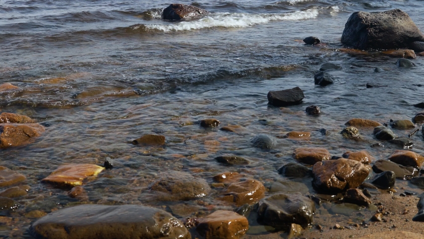 Rocky seashore. Waves splashing on the rocks close-up. | Shutterstock HD Video #1089227255