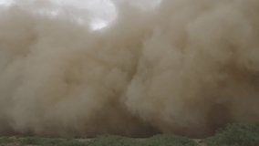View from a car in the steppes of the Sultanate of Oman, a dust storm is moving towards us. - Powered by Shutterstock - Get 15% off with code: PIKWIZARD15