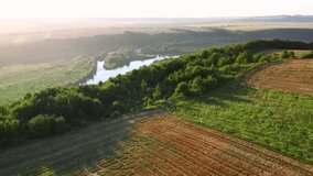 Splendid scene of a large river flowing through meadows. Footage from a bird's eye view. Location place Dniester canyon, Ukraine, Europe. Cinematic drone shot. Filmed in UHD 4k video. Beauty of earth.