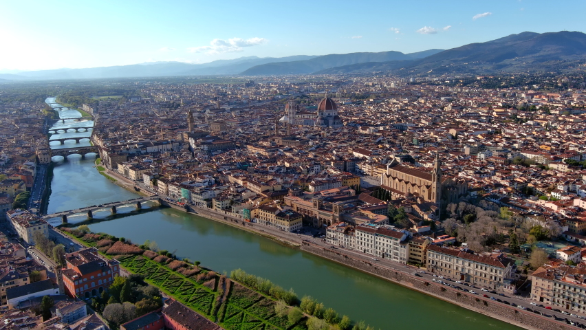 Florence, capital of Italy’s Tuscany region, is home of Renaissance art and architecture. Aerial view iconic sight Duomo Cathedral of Santa Maria del Fiore with beautiful city landscape and Arno River Royalty-Free Stock Footage #1089229303