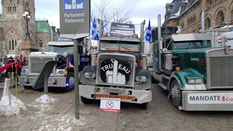Ottawa , Canada - 01 30 2022: Freedom convoy” truckers protest against Covid-19 restrictions.