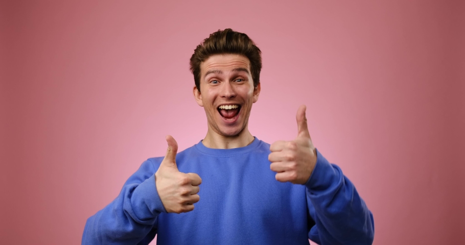 Man giving thumbs up gesture with both hands