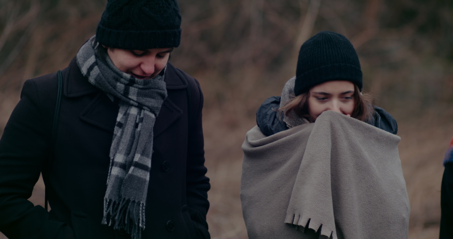 Young Man And Woman Suffering Homelessness In Cold Weather.