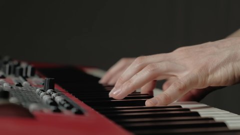 Close up video of professional piano player making music