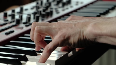 Close up video of professional piano player making music