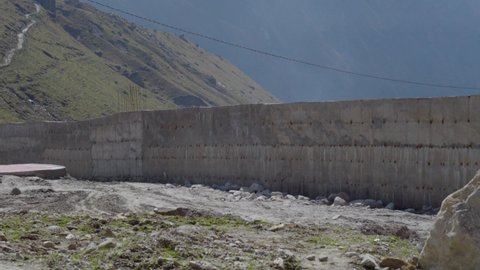 Wall and Wire layer Surrounding around the Valley of Kedarnath. Metalloid wall and cemented wall construction work. High quality 4k footage