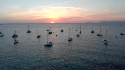Drone video during sunset in Formentera island, overview of yatchs and sea