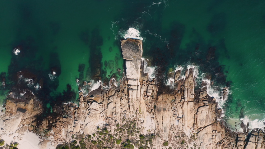 Topdown Of Rocky Shoreline With Turquoise Water At Llandudno Beach In Cape Town, South Africa. Aerial Shot