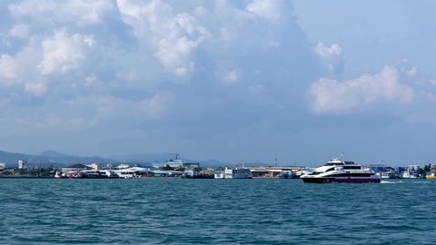 Cebu City , Philippines - 09 29 2019: Cebu City, Philippines - Sept. 29, 2019: Slowed illustrative editorial video showing an interisland fastcraft approaching the Cebu domestic seaport.