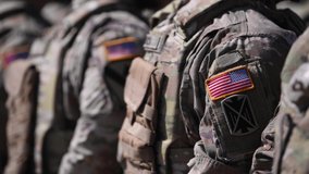 4k video. Detail view of the US Army uniform worn by soldiers in a military base. Flag of America on the uniform. - Powered by Shutterstock - Get 15% off with code: PIKWIZARD15