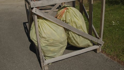 trash bags in wooden crate