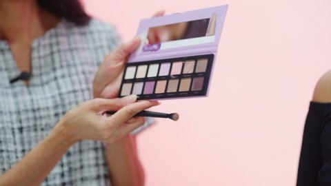 TV Beauty Show Shop Infomercial: Expert Close-up Showcases Eyeshadow Palette, Present Best Products, Cosmetics. Playback Television Commercial Advertisement. Internet Social Media Channel