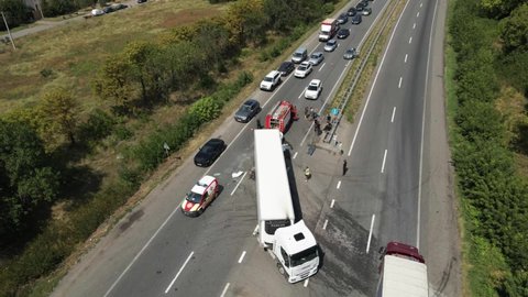 The truck and the car collided on the highway. Strong accident. Traffic accidents on the road. View from above. Traffic jam on the road. DNIPRO, UKRAINE – August 12, 2020