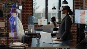 Woman attending business meeting with coworker on hologram, using virtual reality metaverse and VR headset. Virtual reality advanced technology online video conference with holographic high tech image - Powered by Shutterstock - Get 15% off with code: PIKWIZARD15