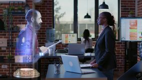 African american business woman using metaverse call with futuristic augmented technology hologram of male colleague to do teamwork on investment project. High tech holographic meeting with man. - Powered by Shutterstock - Get 15% off with code: PIKWIZARD15