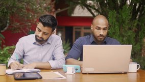   man ask for help to boyfriend and looking at laptop screen gives advice. Gay couple is working together outside in backyard home.  - Powered by Shutterstock - Get 15% off with code: PIKWIZARD15