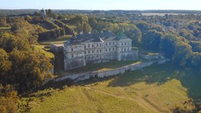 Ukrainian ancient castle Pidhirtsi. Footage from a bird's eye view. Location place Lviv region, Ukraine, Europe. Tourist attraction. Cinematic drone shot. Filmed in UHD 4k video. Beauty of earth.