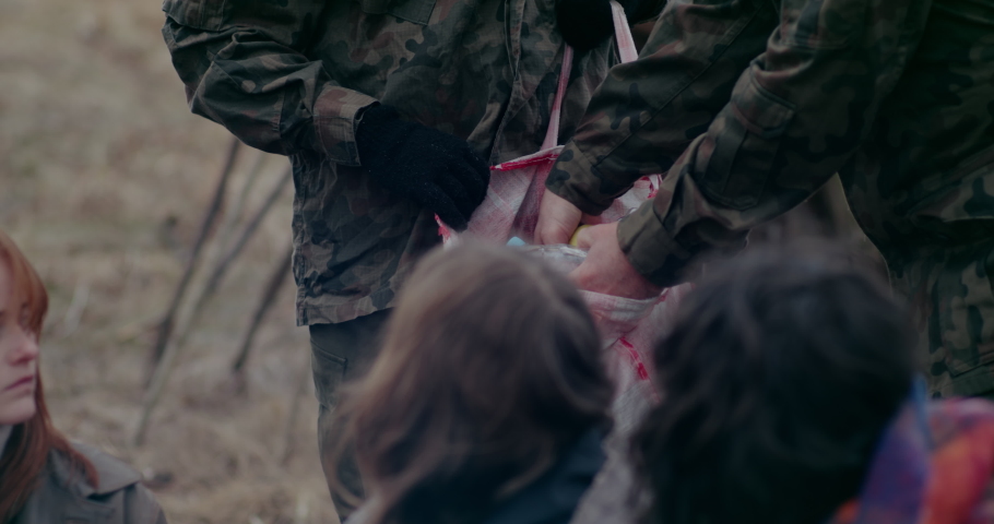 Soldiers Distributing Food And Water During War Problems.