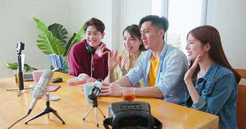 side view of young happy asian friends sharing content on streaming platform with digital web camera - Modern lifestyle have fun vlogging live feeds on social media networks