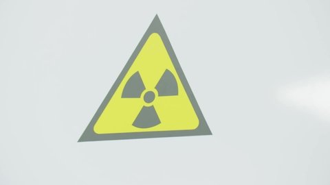 Warning sign on radiology ward room inside the hospital. Biohazard radioactive substances