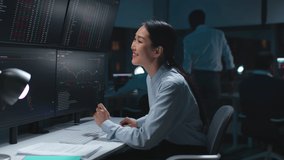 Happy financial analytics looking at screen with chart and smile. Female broker celebrate profitable deal - Powered by Shutterstock - Get 15% off with code: PIKWIZARD15