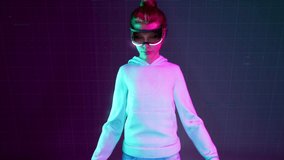 Metahuman. Young female working with virtual or augmented reality glasses. Viewing electronic diagrams and actively gesturing. High AR technologies in entertainment and education. Neon background. 3d