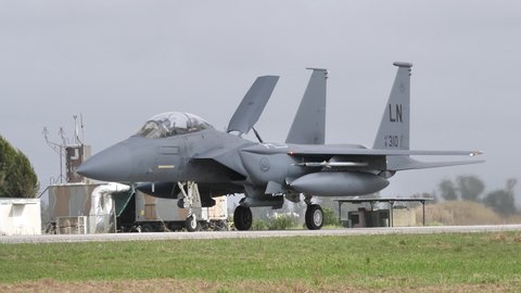 Andravida Greece APRIL, 1, 2022 Close-up follow shoot of an USAF military plane taxiing. McDonnell Douglas Boeing F-15E Strike Eagle American fighter jet of United States Air Force in Europe USAFE