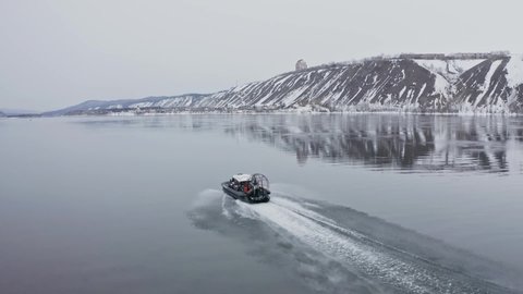 Hovercraft rides on the river in winter