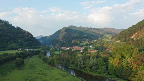 Aerial Drone Top Notch view above Riocorvo Cartes River, in Besaya Valley, Cantabria, North of Spain.