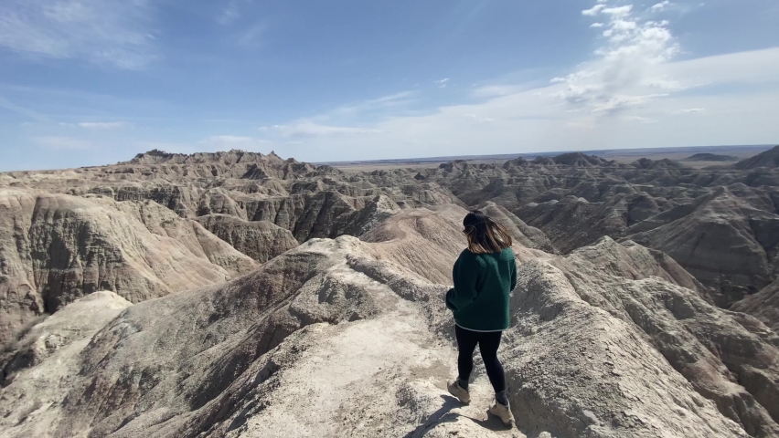 Woman hiking at Badlands National park, South Dakota