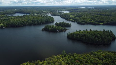 Small islands sit amid a cottage country lake in rural Ontario