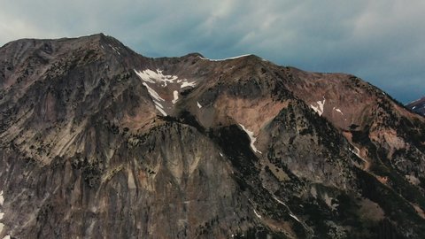 Gothic Mountain, Colorado, USA. Drone Flying Towards Huge Mountainside With Melted Snow.