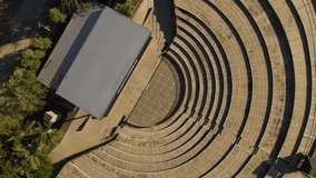 Empty amphitheater and backstage at Villa Maria, Cordoba in Argentina. Aerial top-down circling ascendent