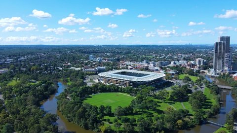 Aerial drone view of Parramatta CBD in Greater Western Sydney, NSW, Australia showing the Stadium, Parramatta River and development of the city as at April 2022 